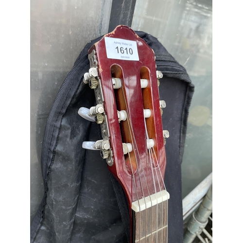 1610 - AN EL PRIMO ACOUSTIC GUITAR WITH CARRY BAG