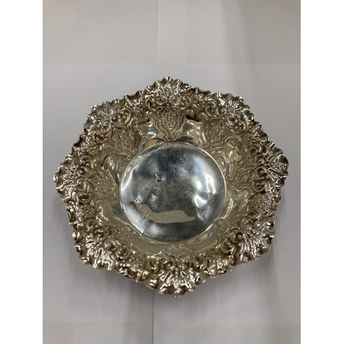 21 - A SILVER HALLMARKED SHEFFIELD REPOUSSE BON BON DISH AND TWO SILVER HALLMARKED BIRMINGHAM LIDDED POTS... 