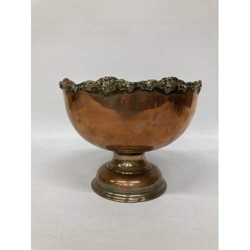 41A - A LARGE VINTAGE COPPER FOOTED BOWL WITH REPOUSSE DECORATION TO THE RIM, HEIGHT 20CM, DIAMETER 26CM