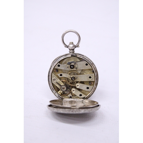 526A - A SILVER LADIES FOB WATCH WITH A DECORATIVE WHITE ENAMEL FACE AND GOLD HANDS.  HALLMARKED 0935 SILVE... 