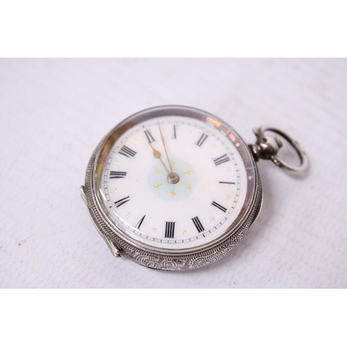 526A - A SILVER LADIES FOB WATCH WITH A DECORATIVE WHITE ENAMEL FACE AND GOLD HANDS.  HALLMARKED 0935 SILVE... 