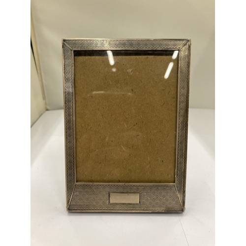 65A - A HALLMARKED SILVER PHOTO FRAME - 9 X 13 CM