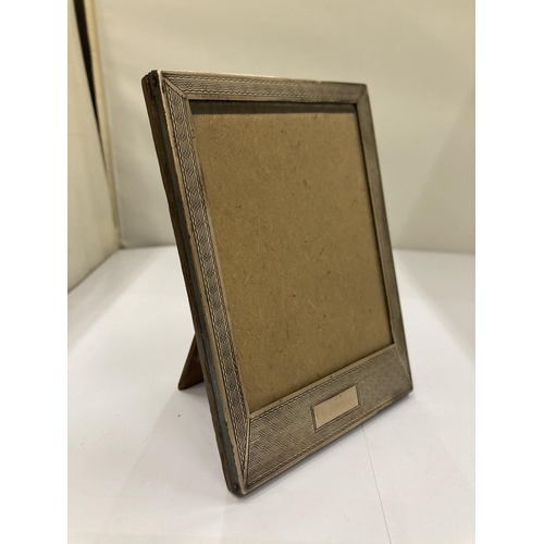 65A - A HALLMARKED SILVER PHOTO FRAME - 9 X 13 CM