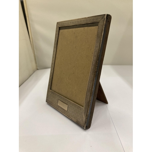 65A - A HALLMARKED SILVER PHOTO FRAME - 9 X 13 CM