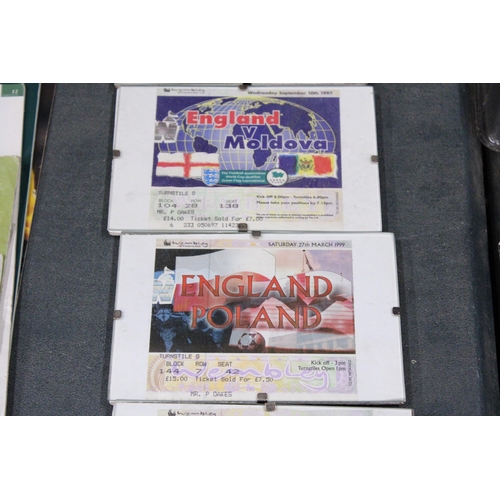 877 - FIVE FRAMED AND GLAZED VINTAGE ENGLAND WEMBLEY FOOTBALL TICKETS