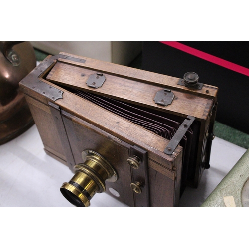 944 - A VICTORIAN WOODEN HALF PLATE CAMERA BY J UNDERWOOD