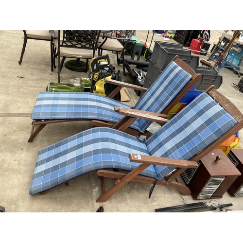 1736 - A PAIR OF TEAK FOLDING SUN LOUNGERS WITH CUSHIONS