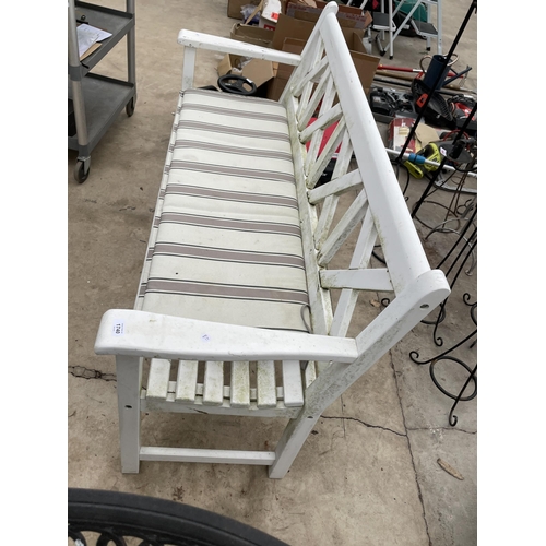 1740 - A WHITE PAINTED WOODEN SLATTED THREE SEATER GARDEN BENCH