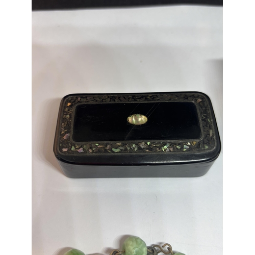 734 - A BLACK LAQUER AND INLAID MOTHER OF PEARL BOX WITH A LUCKY CHARM BRACELET AND AN INGERSOL LTD LONDON... 