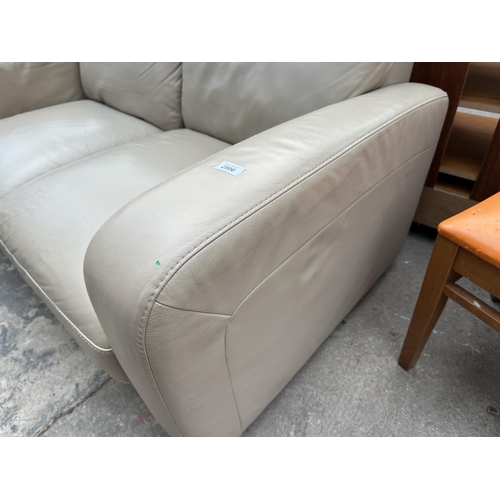 2806 - AN ITALSOFA LEATHER TWO SEATER SETTEE, ONE SECTION BEING A RECLINER