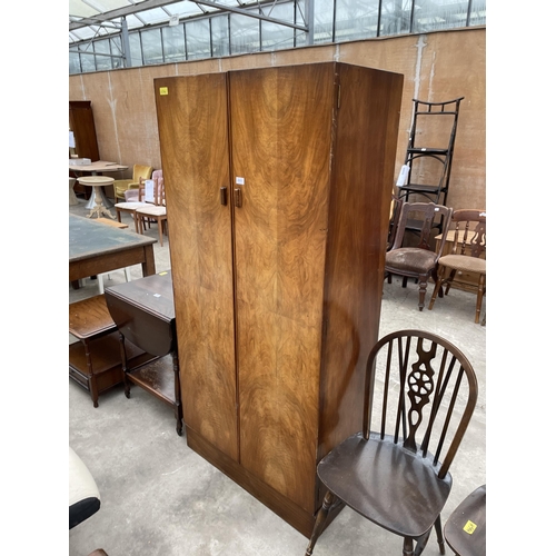 2951 - AN ART DECO WALNUT TWO DOOR WARDROBE, 33