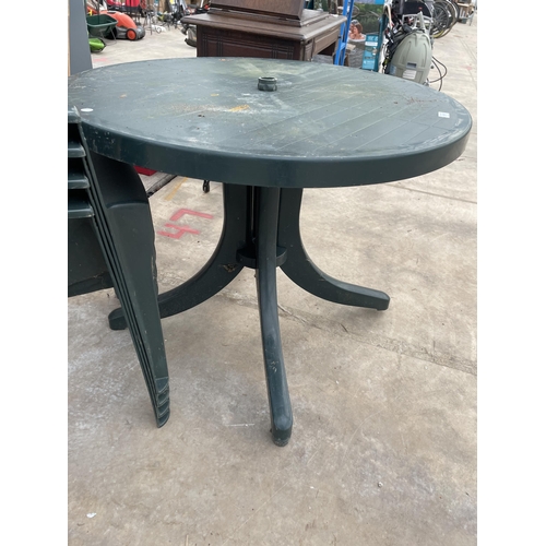 1917 - A GREEN PLASTIC GARDEN TABLE AND FOUR STACKING CHAIRS