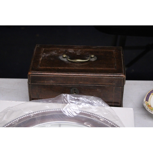 1043 - A VINTAGE MAHOGANY BOX WITH STRINGED INLAY, LOCK AND BRASS HANDLE, LARGE CIRCULAR GLASS AND SILVER P... 