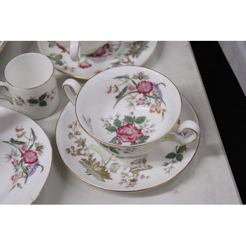 1049 - A QUANTITY OF VINTAGE WEDGWOOD 'CHARNWOOD' DINNER WARE TO INCLUDE VARIOUS SIZES OF PLATES, SERVING P... 