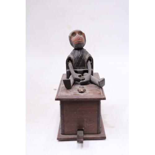 1059 - A WOODEN KOBE TOY MONKEY WITH A SNAKE