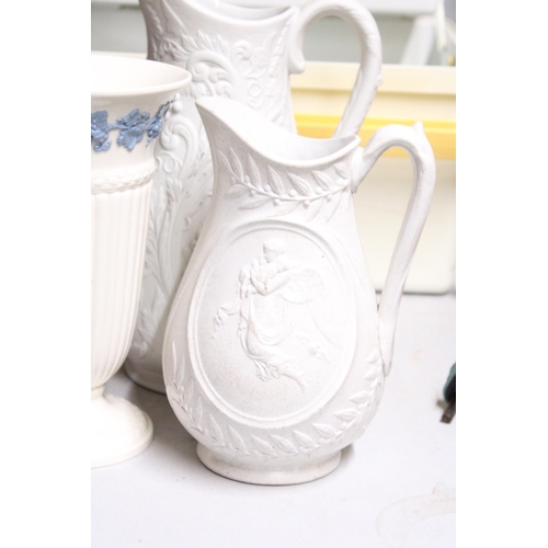 1063 - TWO TALL PARIAN WARE JUGS TOGETHER WITH A WEDGWOOD OF ETRURIA & BARLASTON VASE EMBOSSED QUEENS WARE