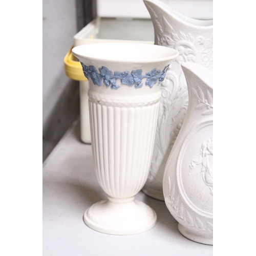 1063 - TWO TALL PARIAN WARE JUGS TOGETHER WITH A WEDGWOOD OF ETRURIA & BARLASTON VASE EMBOSSED QUEENS WARE