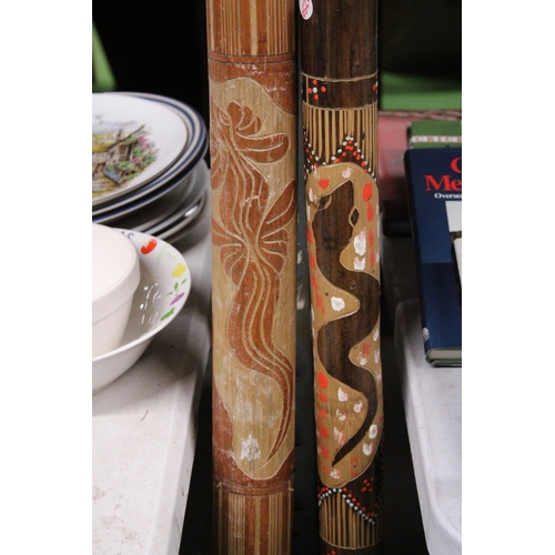 1083 - A HANDPAINTED DIDGERIDOO TOGETHER WITH A RAIN STICK