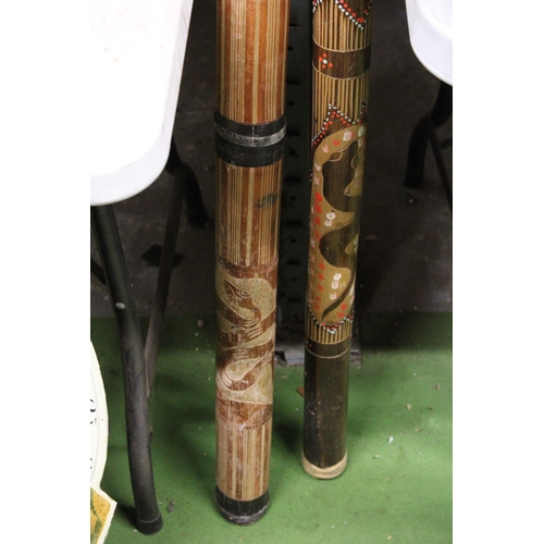 1083 - A HANDPAINTED DIDGERIDOO TOGETHER WITH A RAIN STICK