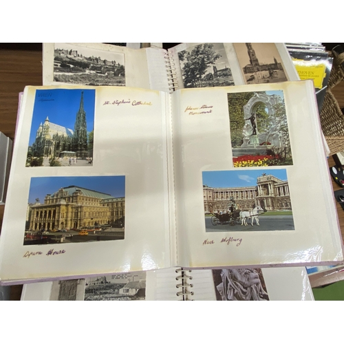 1237 - THREE ALBUMS CONTAINING A COLLECTION OF POSTCARDS, SOME VINTAGE