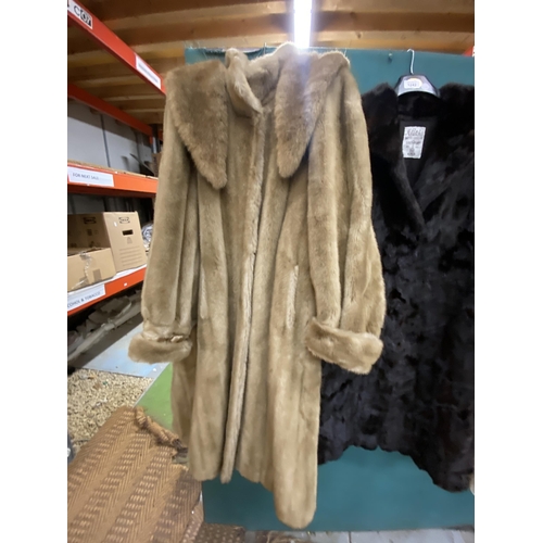 1242 - A LONG FUR COAT AND A FAUX FUR COAT