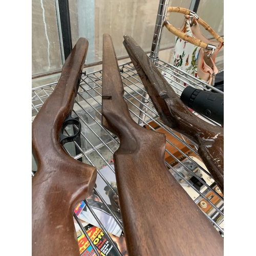 1587 - THREE WOODEN AIR RIFLE STOCKS AND A SPOTTING SCOPE