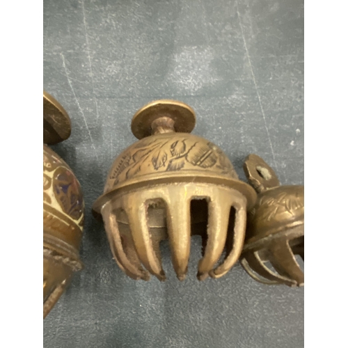 164 - A VINTAGE TRIO OF BRASS CLAW BELLS