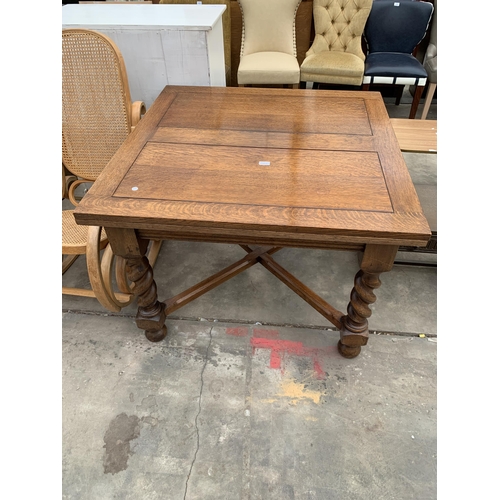 3022 - AN EARLY 20TH CENTURY OAK DRAW LEAF DINING TABLE ON BARLEY TWIST LEGS