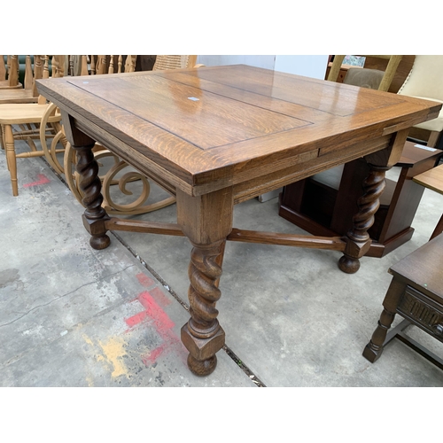 3022 - AN EARLY 20TH CENTURY OAK DRAW LEAF DINING TABLE ON BARLEY TWIST LEGS