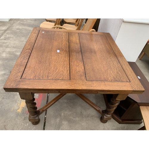 3022 - AN EARLY 20TH CENTURY OAK DRAW LEAF DINING TABLE ON BARLEY TWIST LEGS