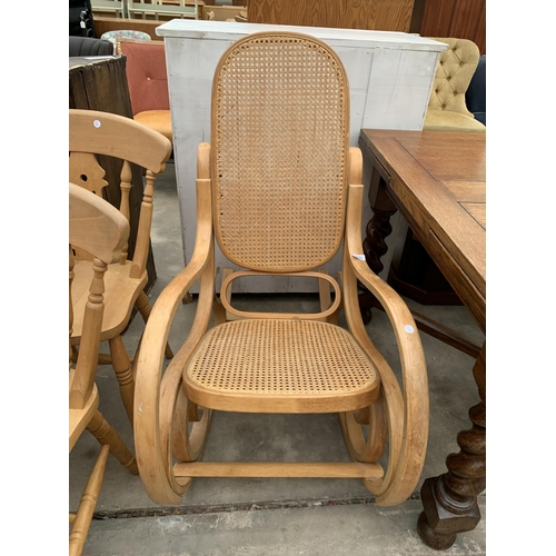 3023 - A BENTWOOD AND CANE ROCKING CHAIR