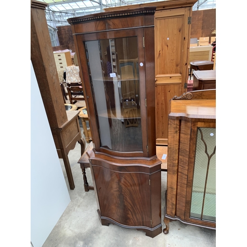 3030 - A MAHOGANY CORNER CUPBOARD