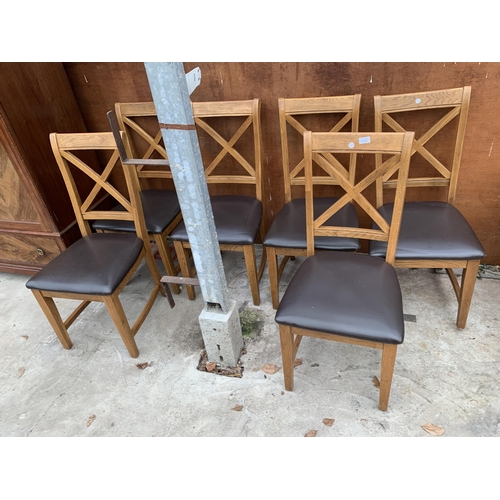 3042 - A SET OF SIX OAK DINING CHAIRS WITH X FRAME BACKS