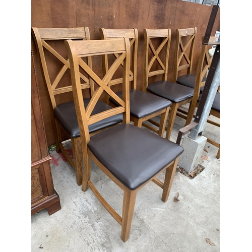 3042 - A SET OF SIX OAK DINING CHAIRS WITH X FRAME BACKS