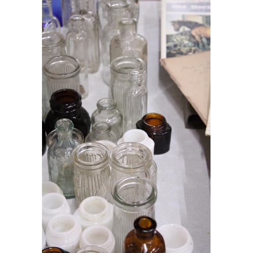 975 - A LARGE COLLECTION OF VINTAGE GLASS BOTTLES AND JARS