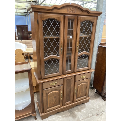 2994 - A HARDWOOD TWO DOOR CABINET ON BASE WITH GLAZED AND LEADED UPPER PORTION, 48