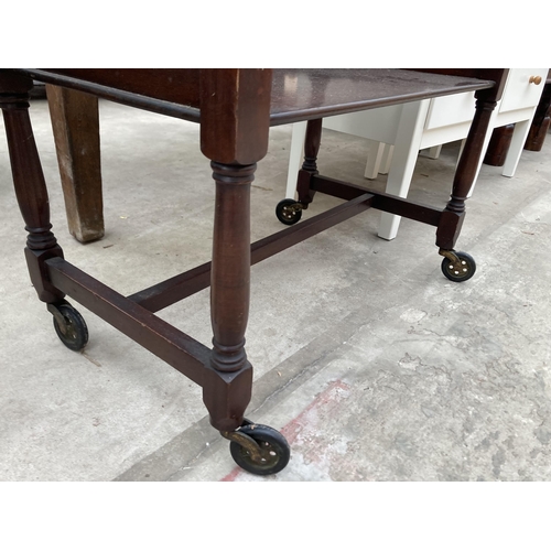 3006 - A MID 20TH CENTURY MAHOGANY TWO TIER TROLLEY WITH FOLD OVER GAMES TOP