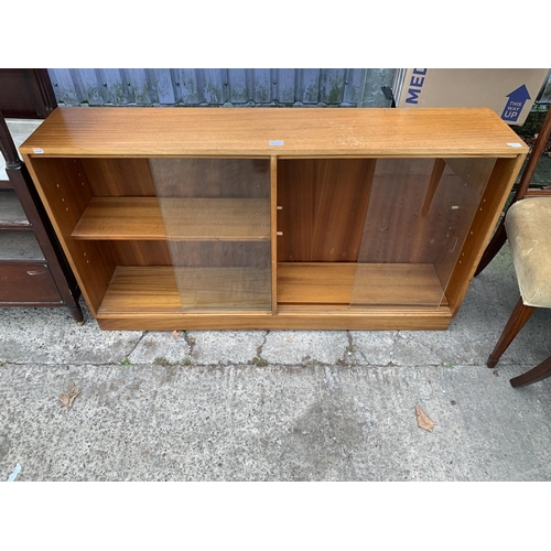 3051 - A RETRO TEAK BOOKCASE WITH SLIDING GLASS DOORS, 53.5