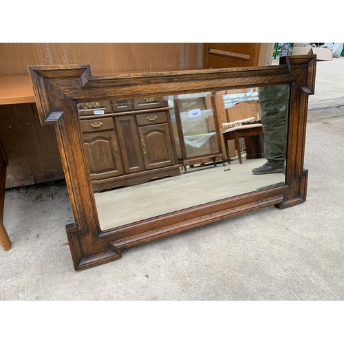 3056 - AN EARLY 20TH CENTURY OAK FRAMED BEVEL EDGE WALL MIRROR, 37.5