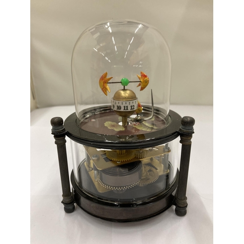 101 - A BRASS AND GLASS AQUA MARINE DOMED CLOCK