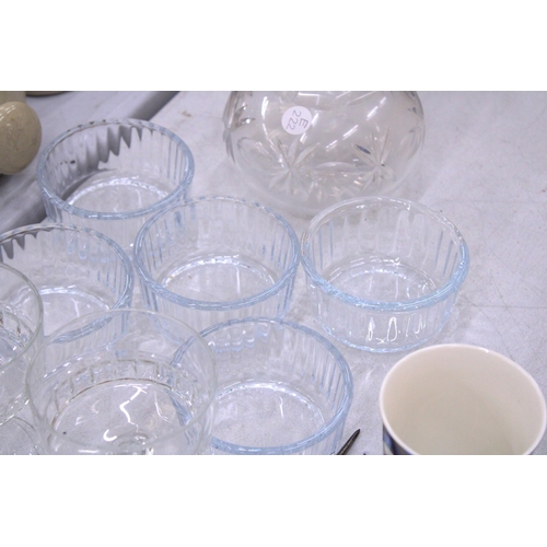 141 - A QUANTITY OF GLASSWARE TO INCLUDE A CUT GLASS DECANTER, DRINKING GLASSES, SUNDAE BOWLS, ETC.,