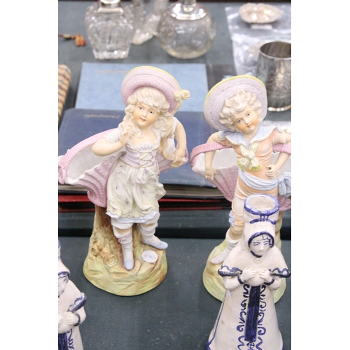 163 - A PAIR OF DELFT STYLE CANDLESTICKS PLUS TWO CONTINENTAL STYLE LADY FIGURES