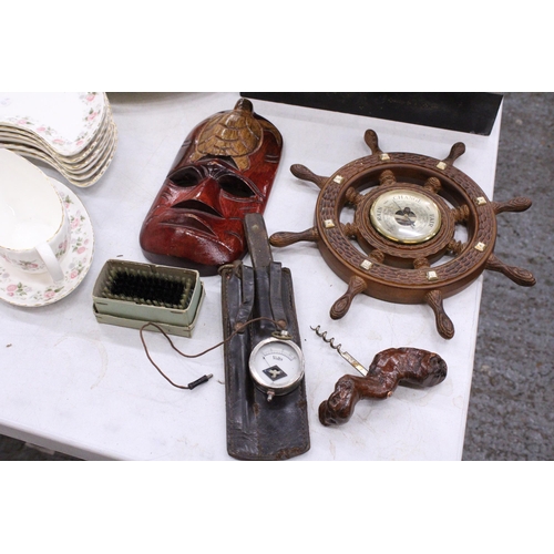 298 - A MIXED LOT TO INCLUDE A WOODEN WALL MASK, SHIP'S WHEEL BAROMETER, VOLTS METER, CORKSCREW, KNIFE IN ... 