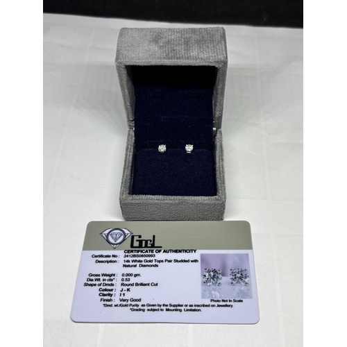 517 - A PAIR OF MARKED 14K SOLITAIRE EARRINGS WITH SCREW ON BUTTERFLY IN A PRESENTATION BOX WITH GEMOLOGY ... 