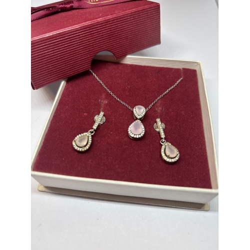 544 - A SILVER AND PINK STONE NECKLACE AND EARRING SET IN A PRESENTATION BOX