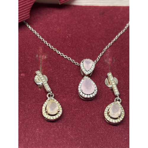 544 - A SILVER AND PINK STONE NECKLACE AND EARRING SET IN A PRESENTATION BOX