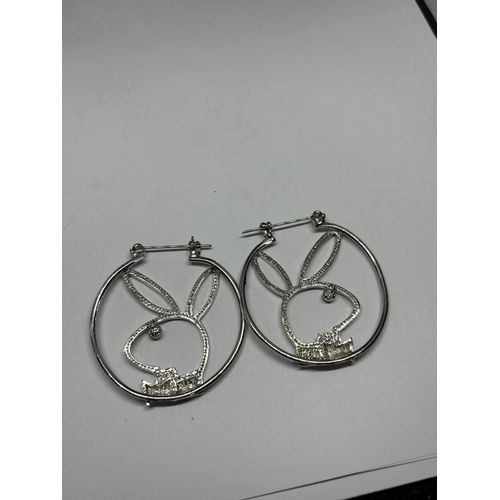 623 - A PAIR OF SILVER PLAYBOY EARRINGS