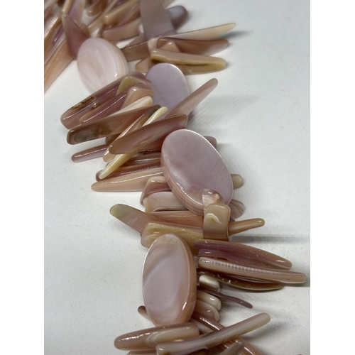 664 - A DOUBLE STRAND PINK SHELL NECKLACE WITH LIZARD DESIGN CLASP