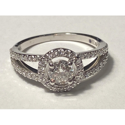 743 - AN 18 CARAT WHITE GOLD RING STUDDED WITH ROUND BRILLIANT CUT NATURAL DIAMONDS. DIANOND WEIGHT 0.46 &... 