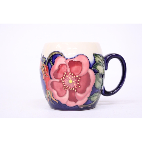 753 - A MOORCROFT MUG WILD ROSE PATTERN